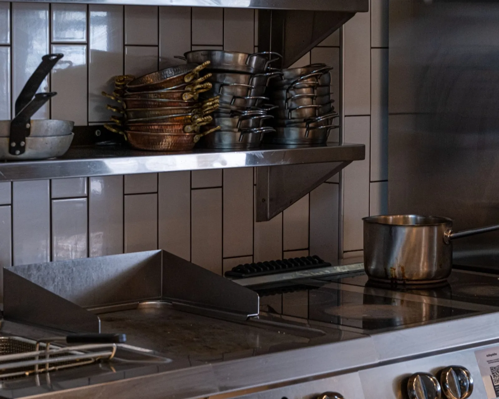 Commercial refrigeration repair: commercial kitchen line with griddle and fryer