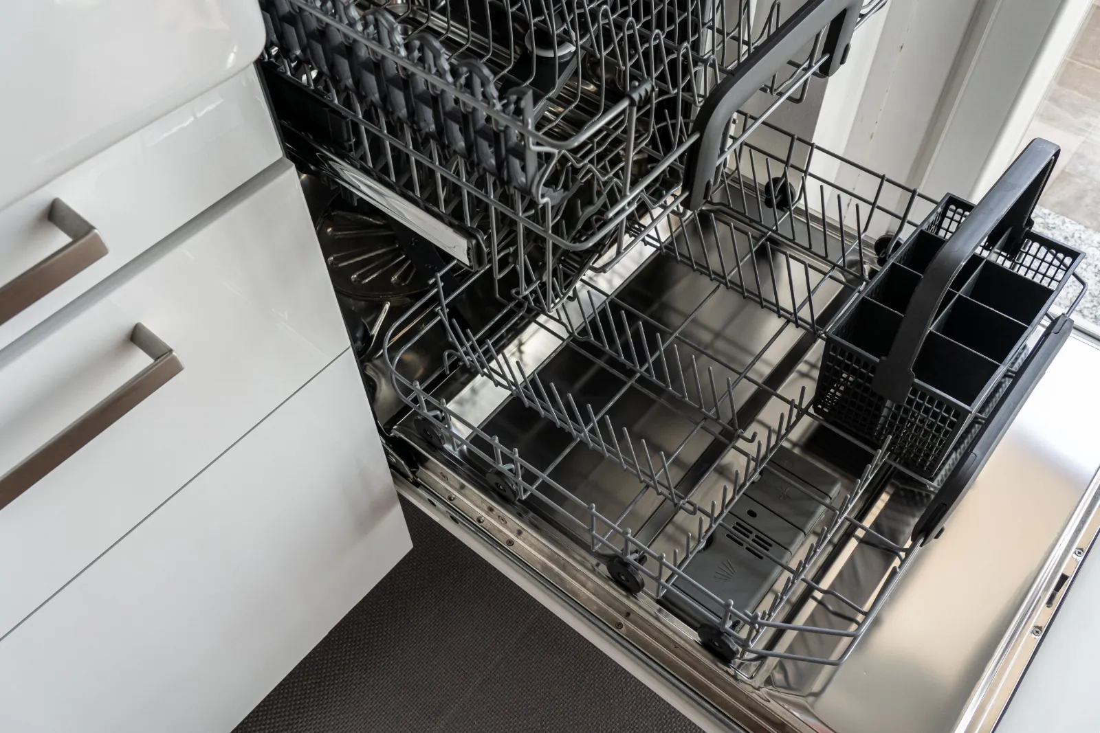 Bosch appliance repair: open dishwasher with empty racks