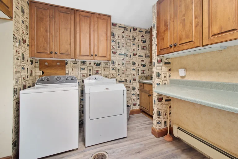 Laundry room with a top-load washer and dryer